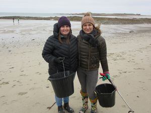 Lauren Le Gallic and Danuta Trzcinska near the start of their hunt for rubbish on Vazon. (Picture by Mark Ogier) (31817200)