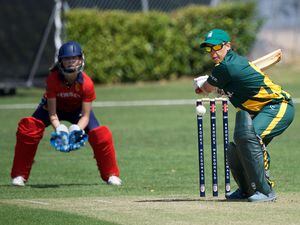Cricket at Grainville. Women's Inter Insular. Jersey fielding (red), Guernsey batting (green)...Bex Hubbard batting.                                                             Picture: ROB CURRIE. (30969271)