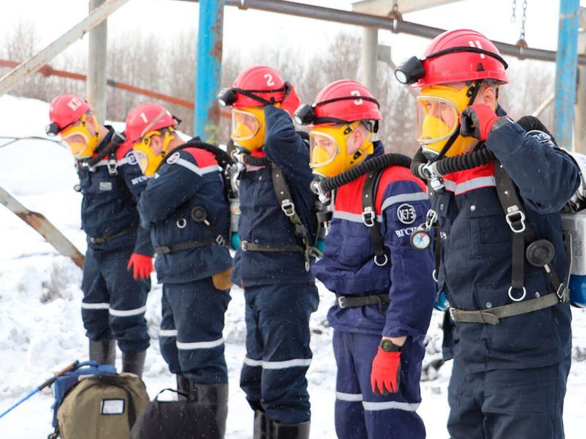 Bid to rescue trapped miners in Russia as 11 killed and dozens injured in fire