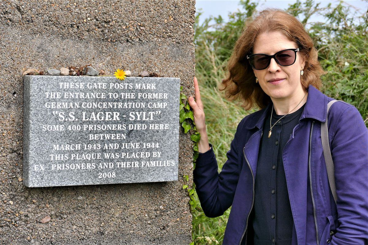Dr Gilly Carr, the Channel Islands’ representative in the International Holocaust Remembrance Alliance, alongside the memorial to the prisoners who died in SS Lager-Sylt. (Picture by David Nash)