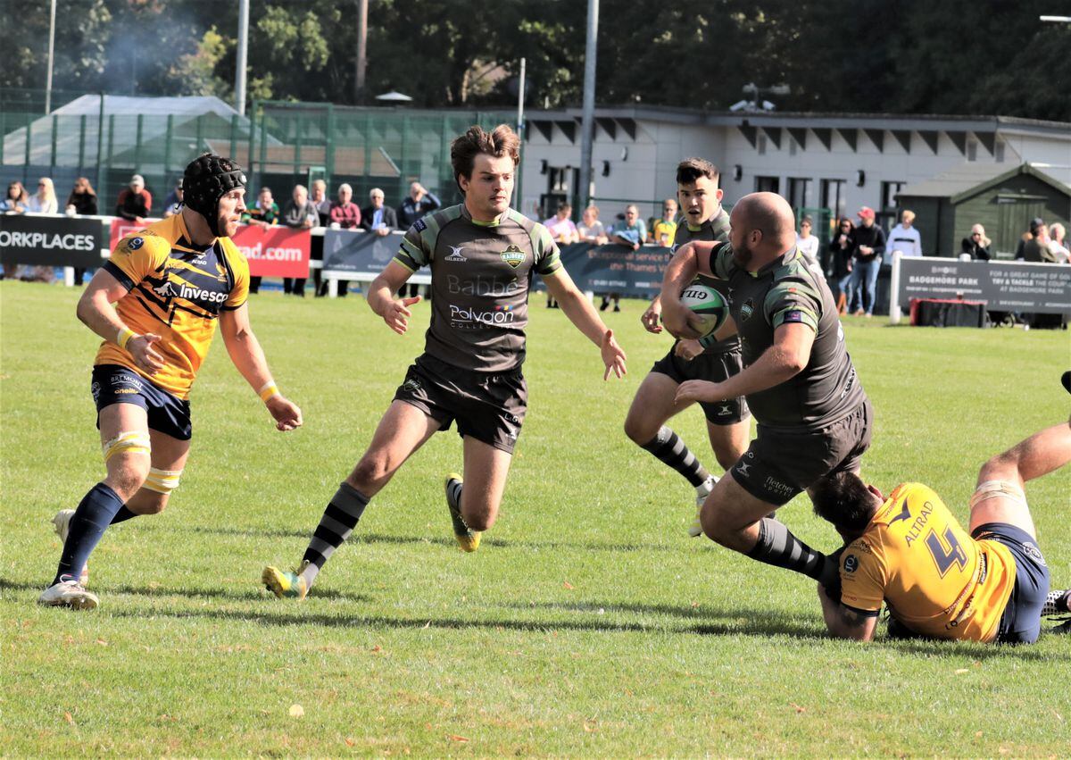 Sam Steventon offloads to Charlie Davies last week at Henley, watched by Owen Thomas. Davies will start at fly-half for Raiders tomorrow after Thomas picked up an injury against the Hawks. (Picture by Mike Marshall, 31280872)