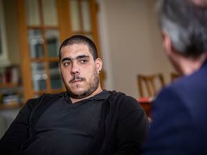Dinarte Capontes explains to Guernsey Press reporter Mark Ogier the treatment he received for a brain aneurysm. He believes his status as a temporary worker meant he was not well served by the island’s health services. (Picture by Sophie Rabey, 31416043)