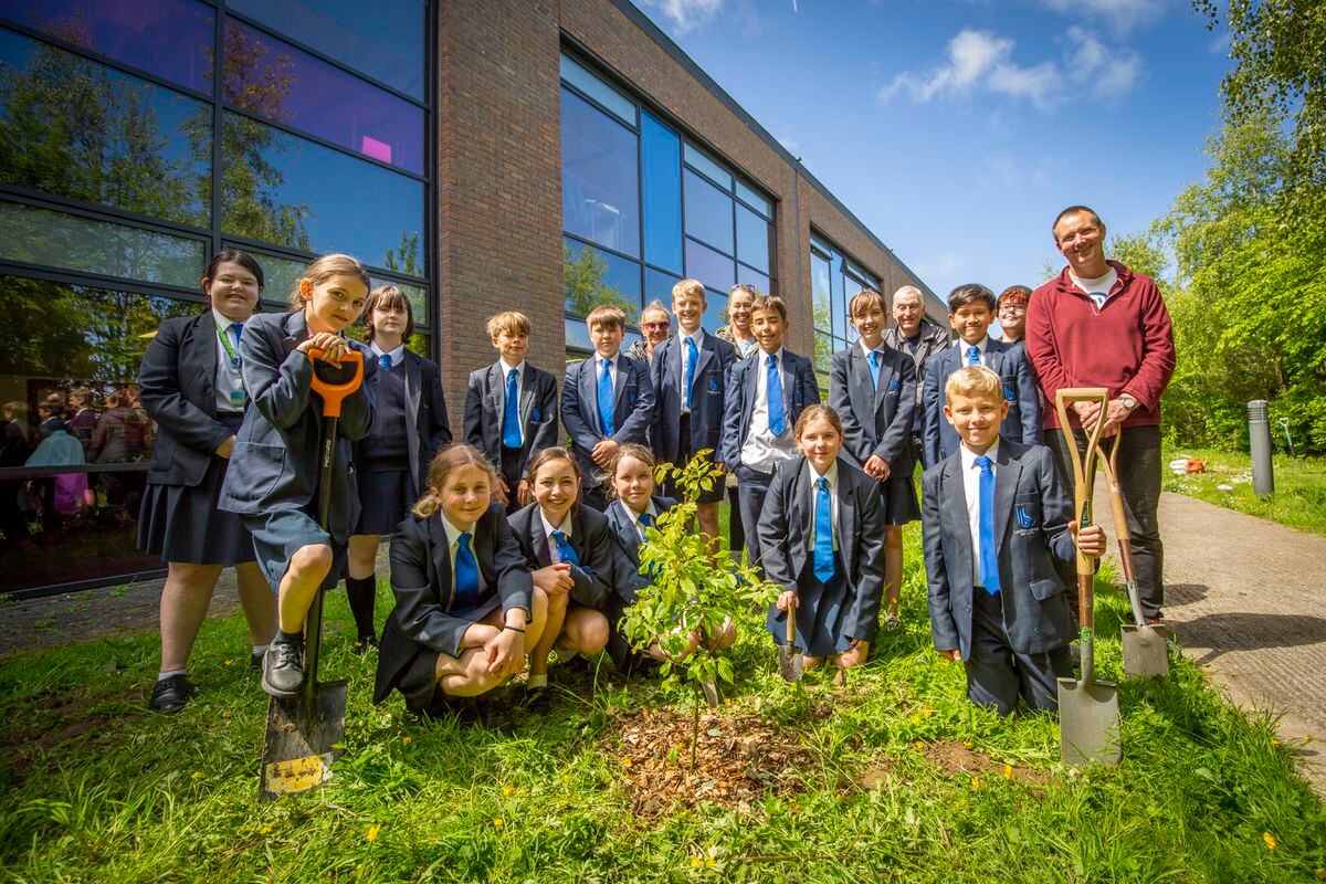 Les Beaucamps High's Year 7 pupils with a tree they planted yesterday. (Picture by Sophie Rabey, 30812143)
