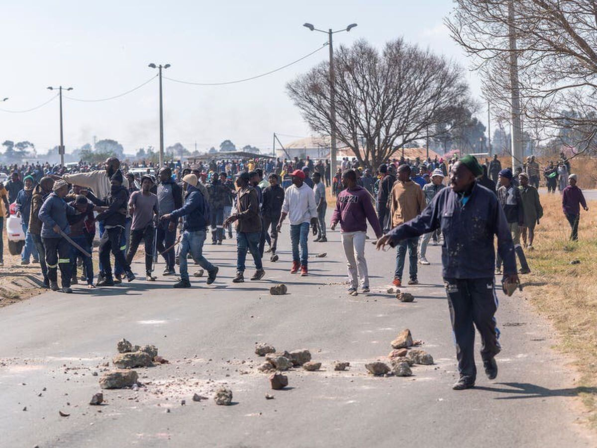 Clashes in South Africa as illegal miners targeted after alleged gang rapes