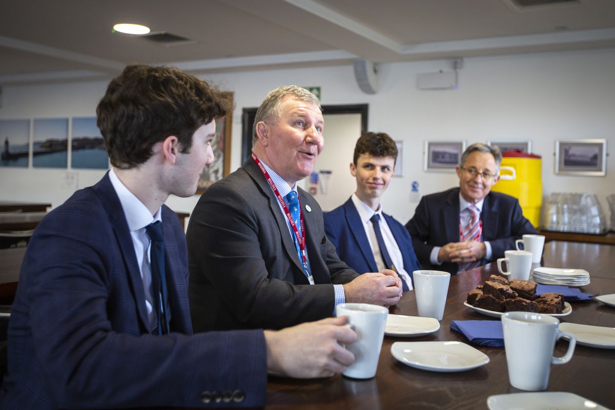 The Lt-Governor, Lt General Richard Cripwell enjoyed a hot drinks and brownies in the refectory after his tour of Elizabeth College. Joining him and his secretary Major Marco Ciotti, right, were Jonathan Vickers, 17, left, and Joshua Merrien, 18. (Pictures by Luke Le Prevost, 31685833)