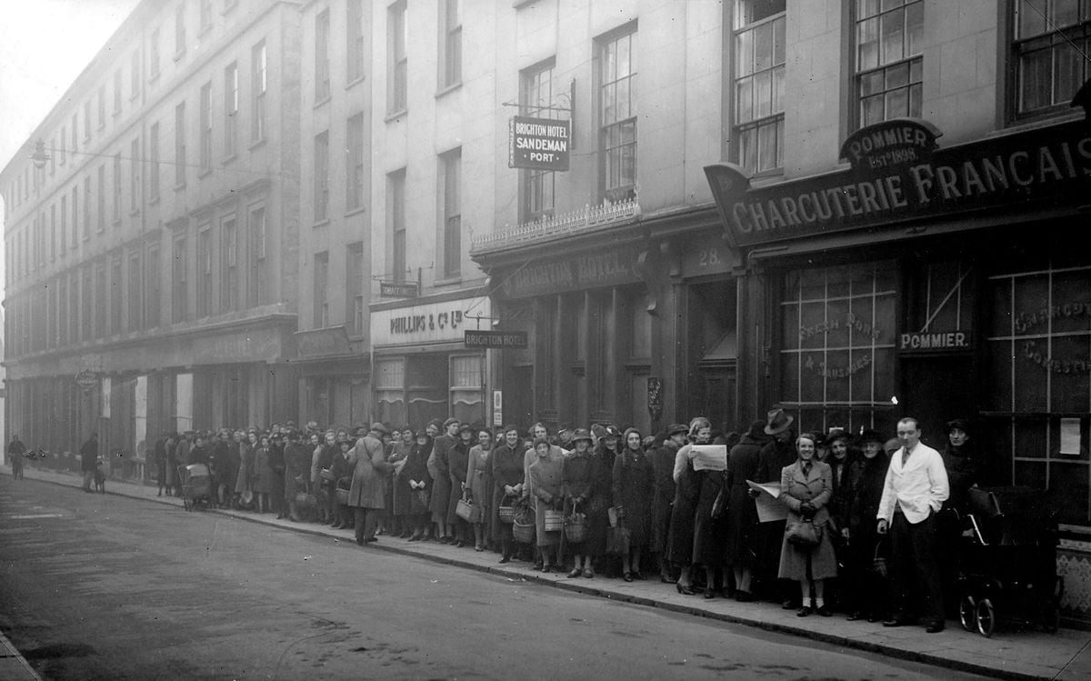 Locals queue outside Pommier's Charcuterie Francaise in Fountain street, St Peter Port during the German Occupation. Image supplied by Ron Gould from the collection of Bert Gould (29407762)
