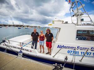 Left to right: Alderney Ferry Service’s lead skipper Clive Braund, director Charlie Smith, and director and lead skipper Dan Slimm aboard the firm’s new vessel, Causeway Explorer, in St Peter Port Harbour yesterday.  (Picture by James Black, 30986536)