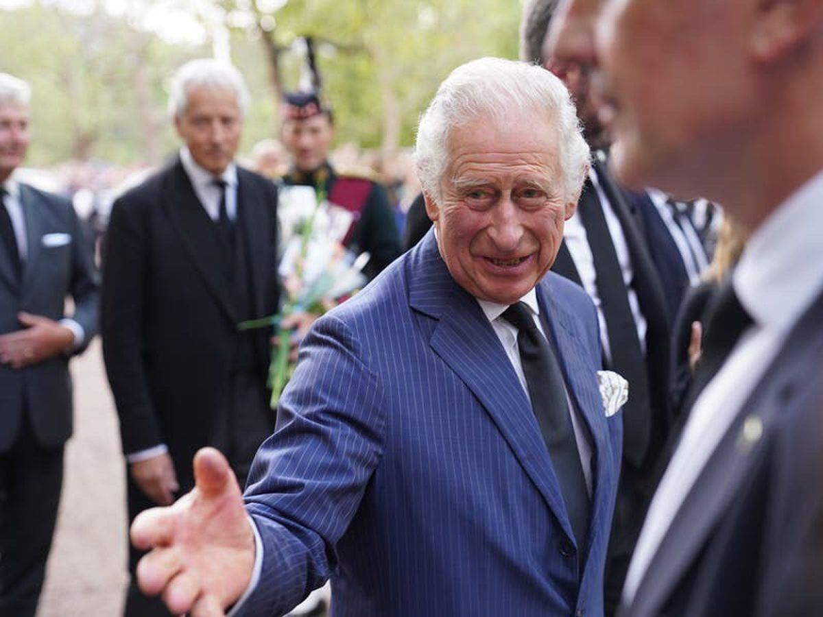 King and Queen shake hands with well-wishers at Clarence House ...