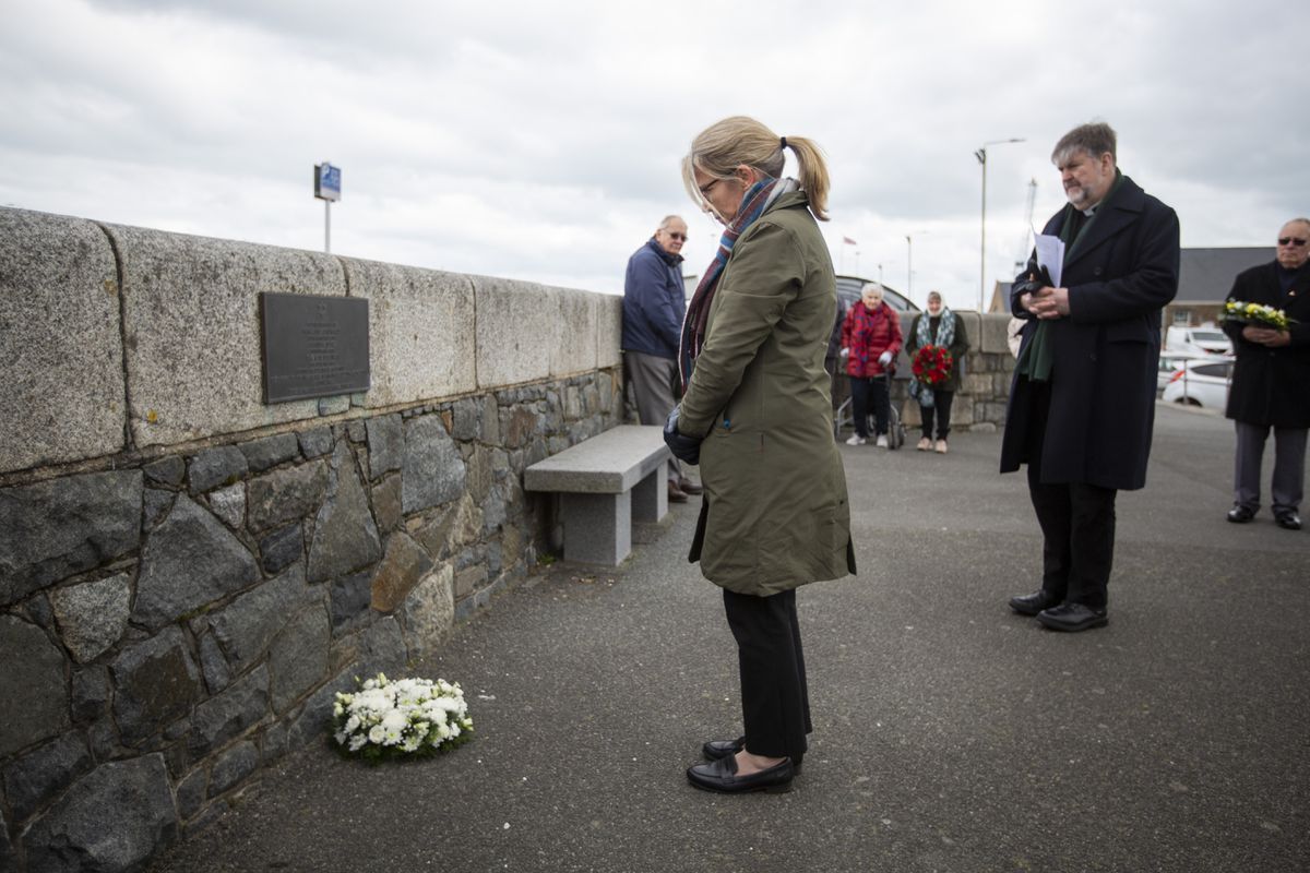 Deputy Bailiff Jessica Roland lays a wreath at the plaque dedicated to the three Jewish women who were living in Guernsey and who were sent to their deaths in Auschwitz. (Pictures by Luke Le Prevost, 31744845)