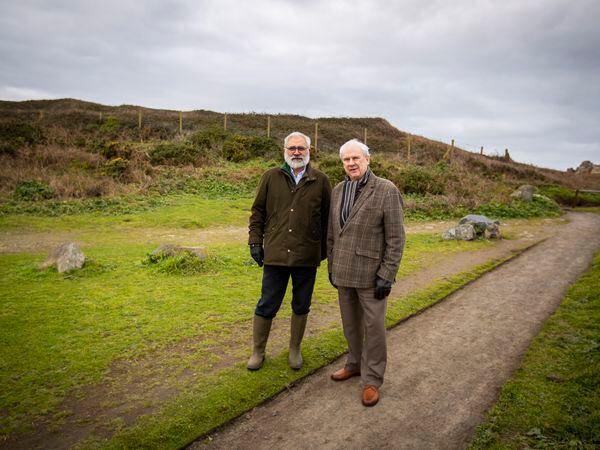 National Trust of Guernsey president Mike Brown, left, and his opposite number at La Societe Guernesiaise, Roy Bisson, at Creve Coeur, which the two charities will work on together. (Picture by Sophie Rabey, 31763671)