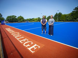 Elizabeth College principal Jenny Palmer and head of hockey Andy Good on the all-terrain hockey pitch at the Memorial Field which is nearing completion. (Picture by Peter Frankland, 32255670)