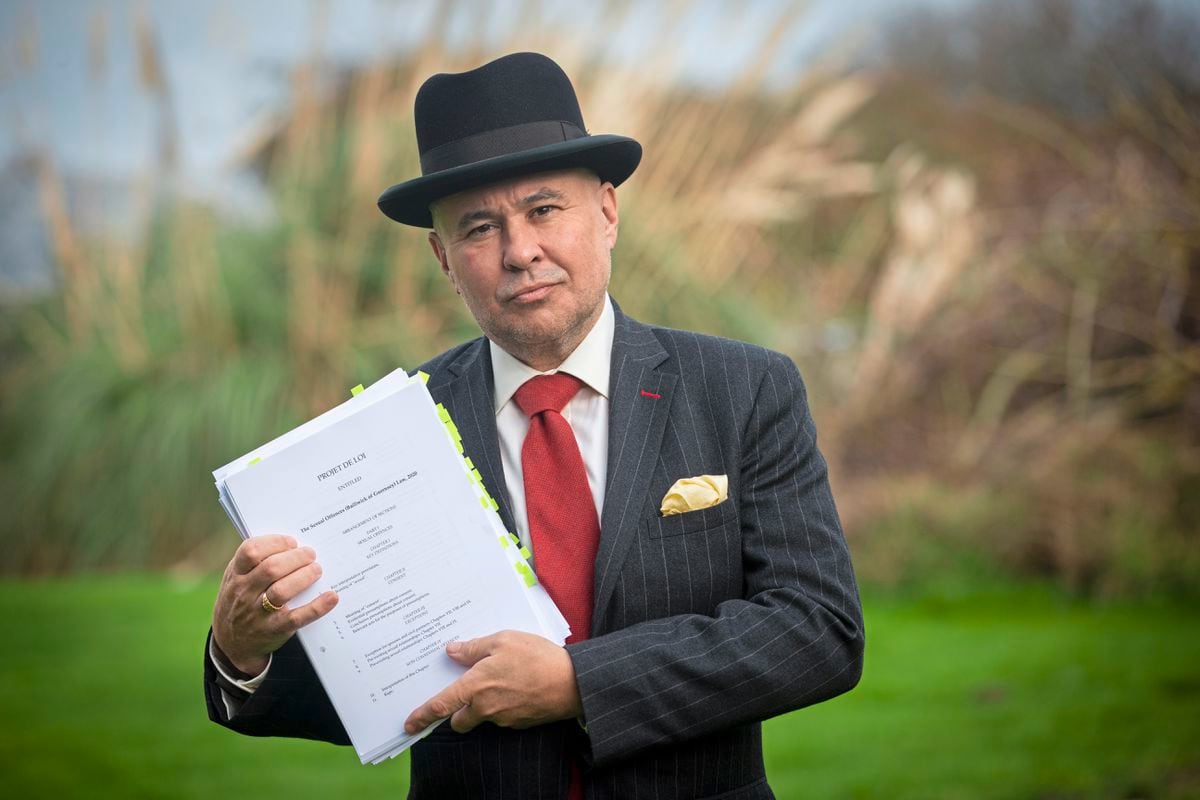 Carl Meerveld holding the Sexual Offences (Bailiwick of Guernsey) law 2020. He is concerned the proposal is a step too far and undermines the legal principal of innocent until proven guilty. (Picture By Peter Frankland, 30481178)