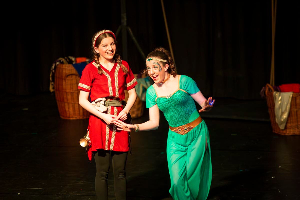Katie Luxon, left, who played the gullible Ali Barbara – taken in by a persuasive genie played by Mia Larbalestier in The Genuine Genie – won the Rollie Wolley Memorial Trophy for the outstanding performance by an individual at the festival. (Picture by Luke Le Prevost, 32146263)