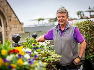 Picture By Sophie Rabey.  19â10-21.  Nigel Clarke from Queux Plant Centre has been putting up planters in St Peter Port Town Centre, with flowers that will last throughout the winter.. (30105861)