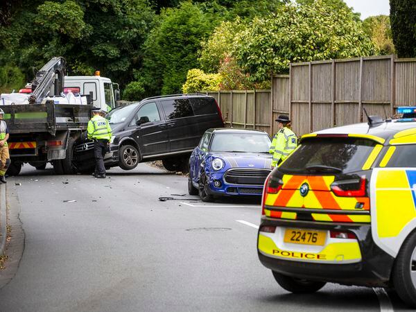 The damaged Mini can be seen at the stop line for the traffic lights junction, while the Mercedes van was pushed back by the impact with the lorry and lifted onto a low wall. (Picture supplied by Sydney Prosser)