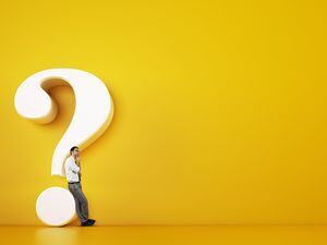 Man leaning on a big white question mark on a yellow background. 3D Rendering (31262608)