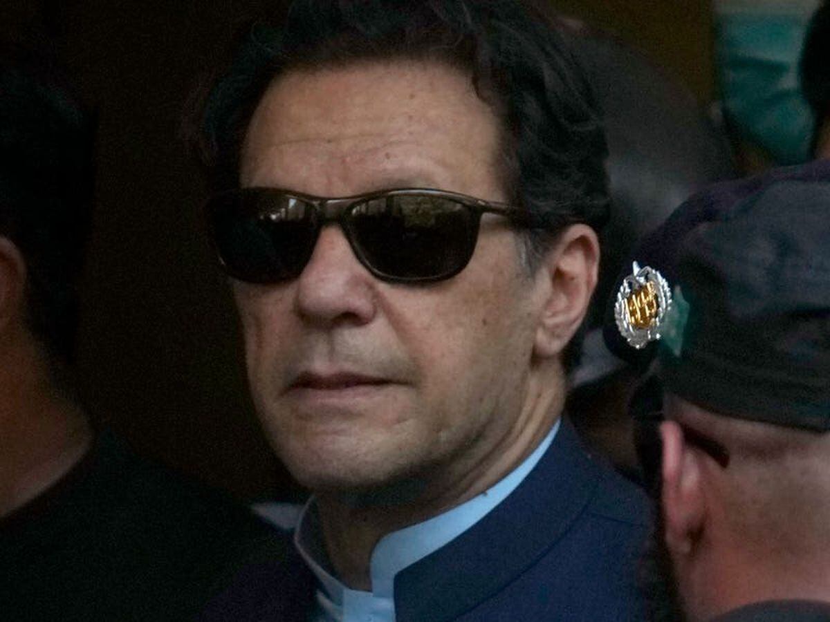 Former Pakistani premier Imran Khan says police are surrounding his home