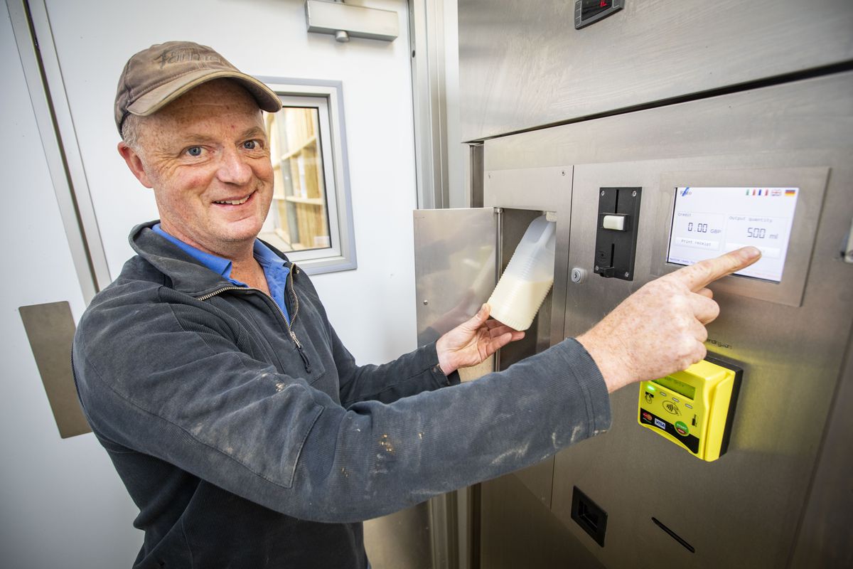 Farmer Jason Salisbury with the popular milk vending machine.