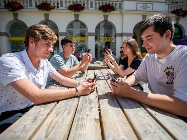 Picture by Luke Le Prevost. 29-07-22..A recent report shows users are phoning and texting less and using more mobile data on their mobile phones. L-R Alex Potter, Cormac Wrigley, Izzy Gamble and Kian Hamon. (31138936)