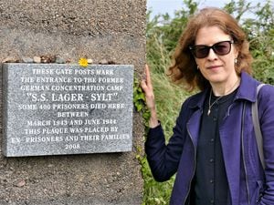 Dr Gilly Carr, the Channel Islands’ representative in the International Holocaust Remembrance Alliance, alongside the memorial to the prisoners who died in SS Lager-Sylt. (Picture by David Nash)