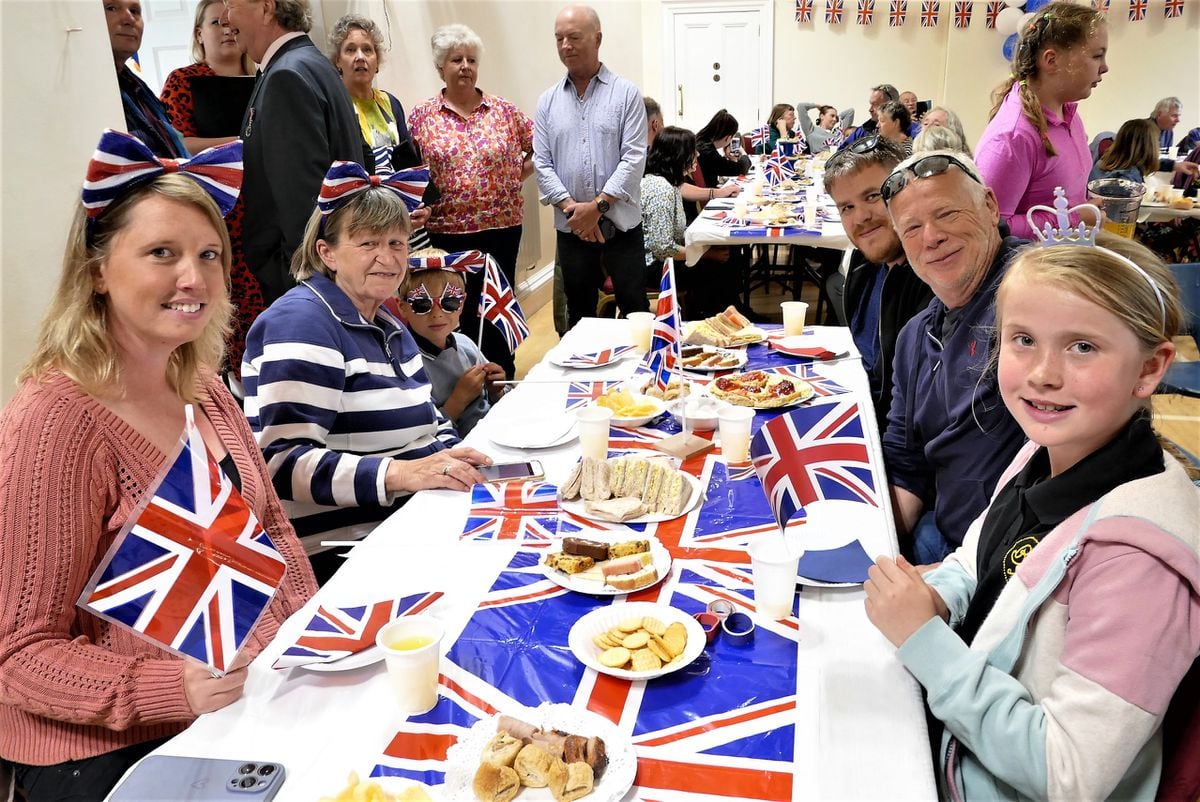 Alderney residents enjoying the Coronation celebrations at the Island Hall, where there were also refreshments and entertainment.(Picture by David Nash, 32087843)