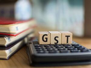 Word of GST spelled with colorful wooden alphabet blocks.Selective focus,shallow depth of field (30026134)