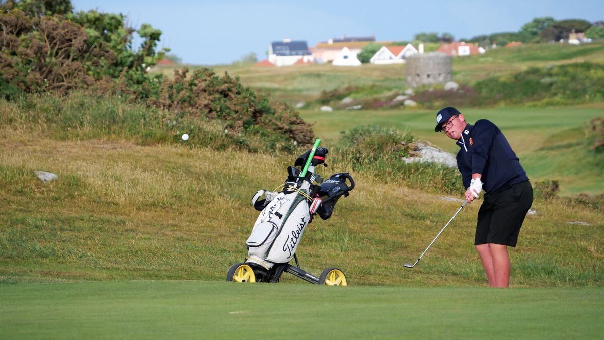 Ollie Chedhomme chips onto the 12th green. (Picture by Gareth Le Prevost, 30852564)