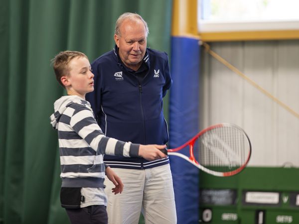 Picture by Luke Le Prevost. 26-04-22..Lawn Tennis Association president David Rawlinson visited the Guernsey Tennis Club and received a tour of the facilities and engaged with young tennis players. David Rawlinson speaking to Rory Tolcher (11). (30757939)