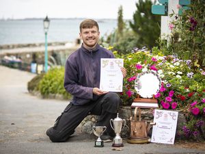 Liam Gaughan, head gardener on Herm, with the awards won in the Floral Guernsey Community competition. (Picture by Sophie Rabey 25981210)
