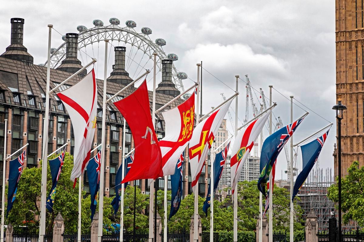 The Guernsey flag flying outside the Houses of Parliament, along with those of the other countries and crown dependencies of the UK. (Jane Rix/Shutterstock.com) (30898159)