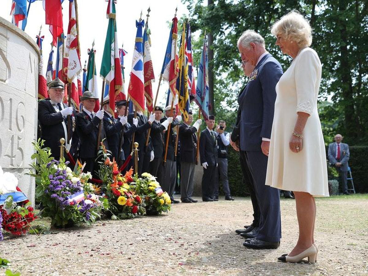 In pictures: Charles and Camilla lay wreath in poignant VE Day tribute ...