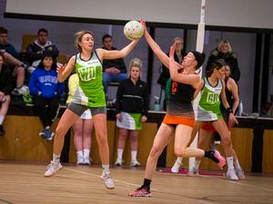 Spectators look on as player of the match winners Bonnie Le Noury (left) and Abbie Greening contest an airborne ball. (Picture by Luke Le Prevost, 31804299)