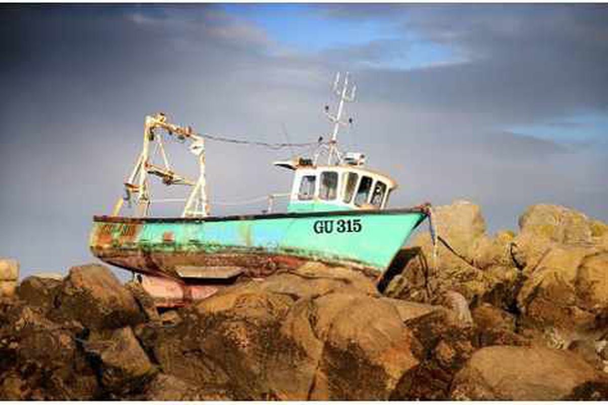 Boat On Rocks Must Wait For Bigger Tides 