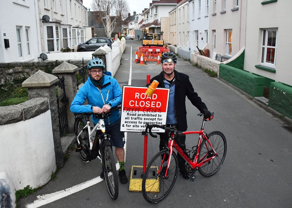 Jamie Rive, left, and Barrie Duerden, a committee member of the Better Journeys Project, say cyclists can beat roadworks such as these at Nocq Road, St Sampson’s.(Picture by Andy Brown, 31549653)