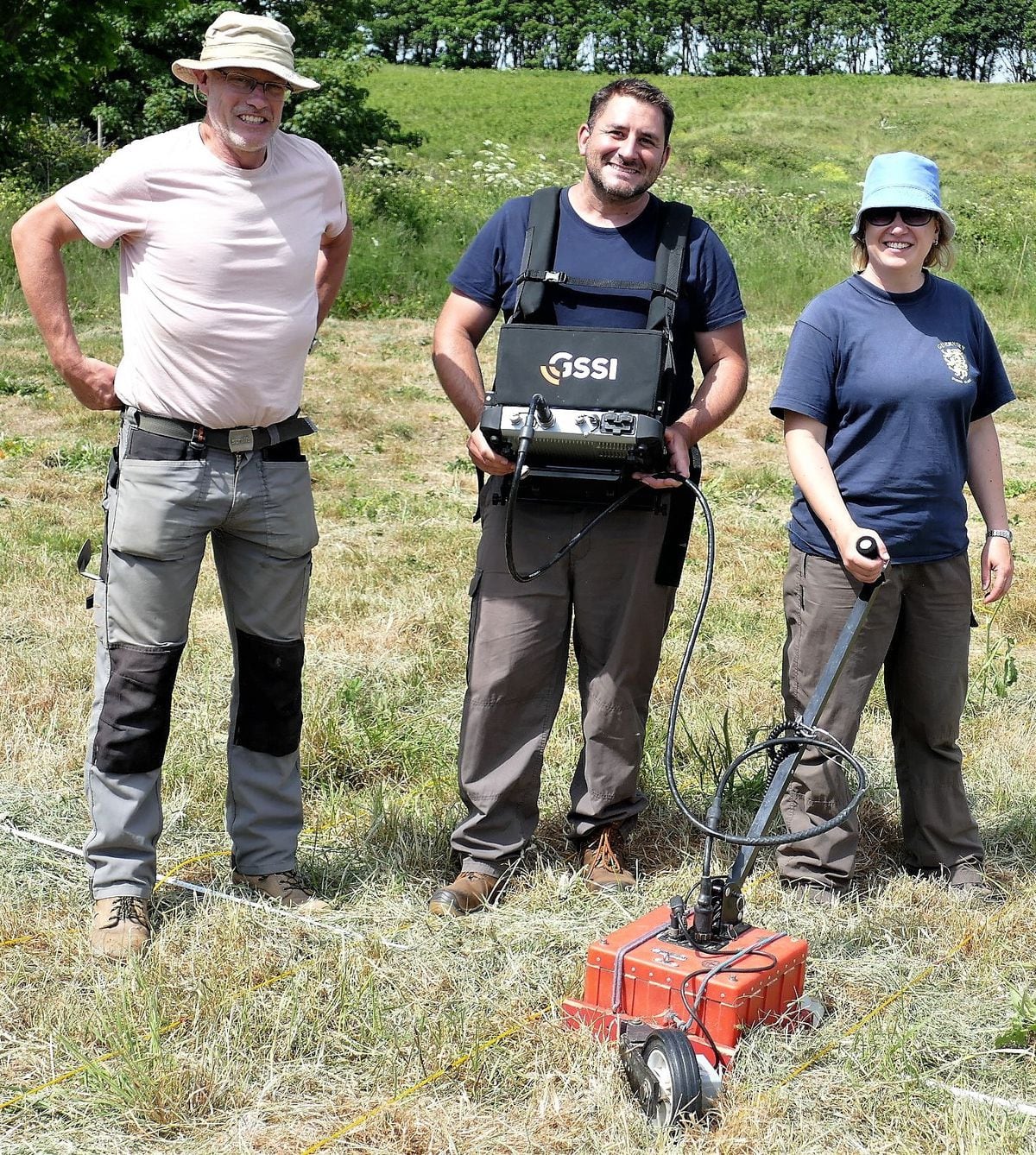 Andy Lane, left, Dr Rob Fry and Louise Randell, with the ground penetrating radar kit on Longis Common. (Picture by David Nash)