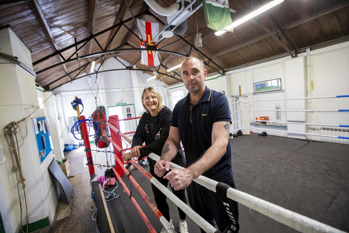 Steve Mourant has written a letter, in response to the ongoing dispute of the Sports Commission's funding, about how boxing helped his mental health. Left to right: Boxing development officer Mandy Hobart and Mr Mourant inside the Guernsey Amalgamated Boxing Club. (Picture by Luke Le Prevost, 32181743)