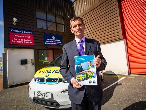 Head of Bailiwick Law Enforcement Ruari Hardy with a copy of his annual report. (Picture by Sophie Rabey, 32309128)