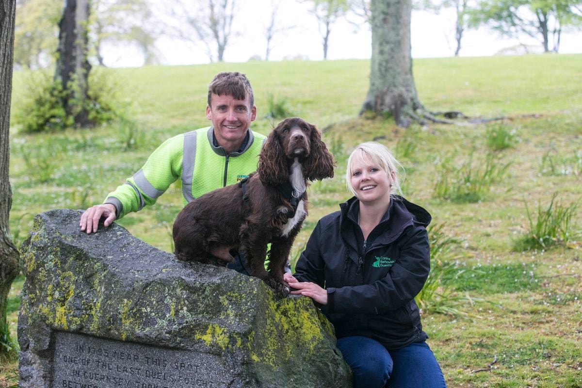 Anna Brehaut from Canine Behaviour Guernsey with dog Buddy and Postie Clint King. (29544790)