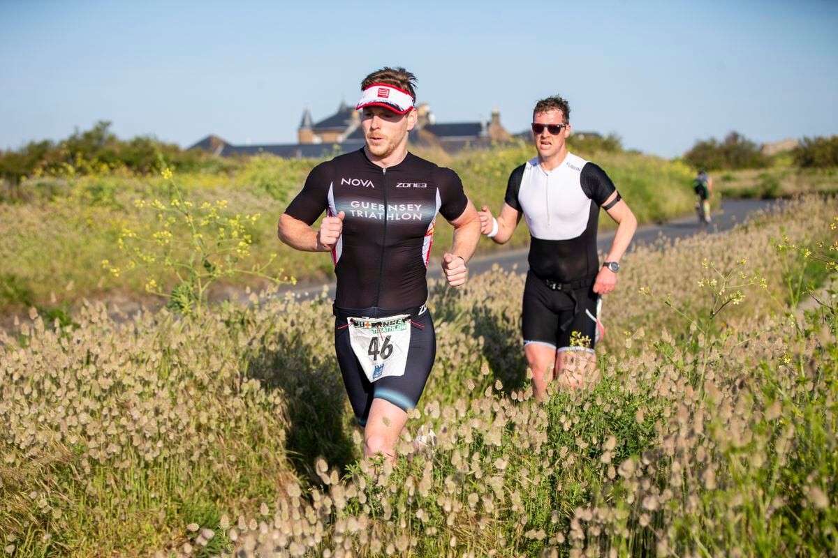 Chris Norman leading James Travers on the run leg of Sunday’s Grandes Rocques Super Sprint triathlon. (Picture by Luke Le Prevost, 32136716)