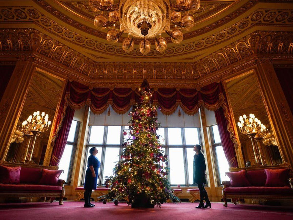 In Pictures: Royal staff deck Windsor Castle hall with 20ft Christmas tree
