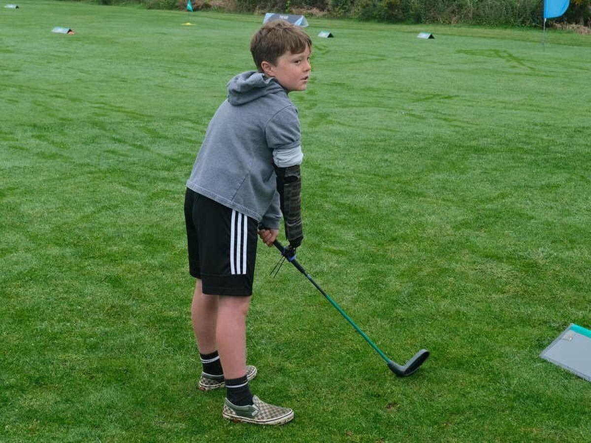 Boy with limb difference ‘excited’ to play golf with grandfather thanks to tool