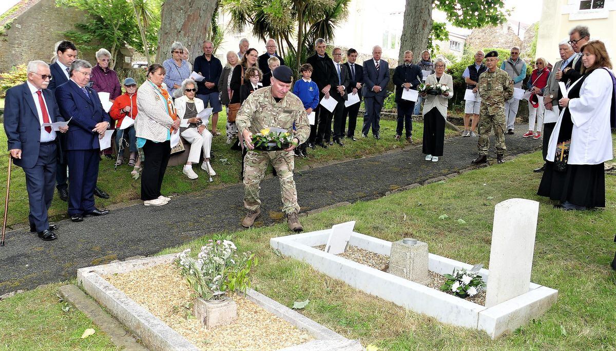 The Lt-Governor Lt-General Richard Cripwell, laying a wreath on the grave of Sapper George Onions, the only British soldier to die in Alderney during the Second World War. (Pictures by David Nash)
