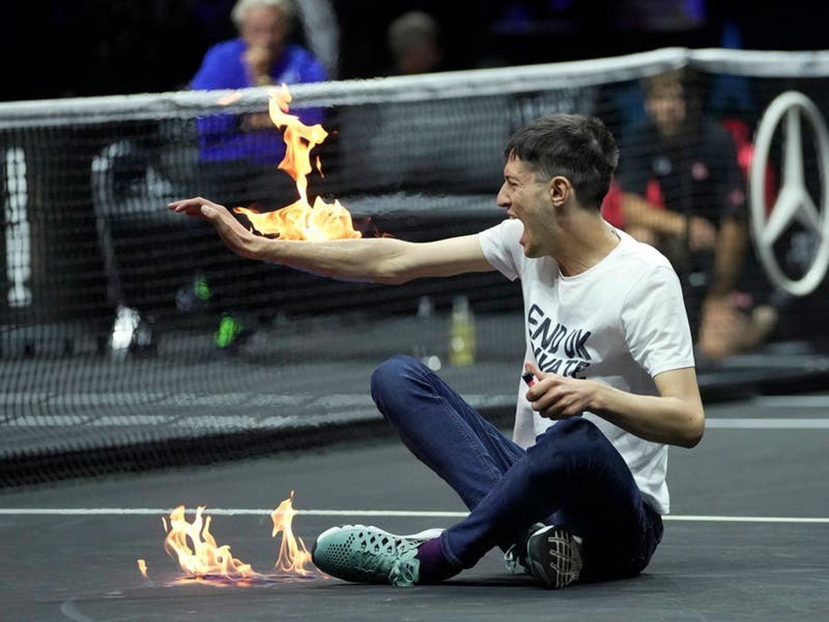 Players stunned as protester sets arm on fire in dramatic incident at Laver Cup