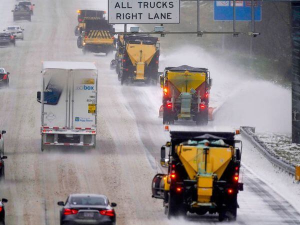 Tens of thousands without power as winter storm blasts US south-east