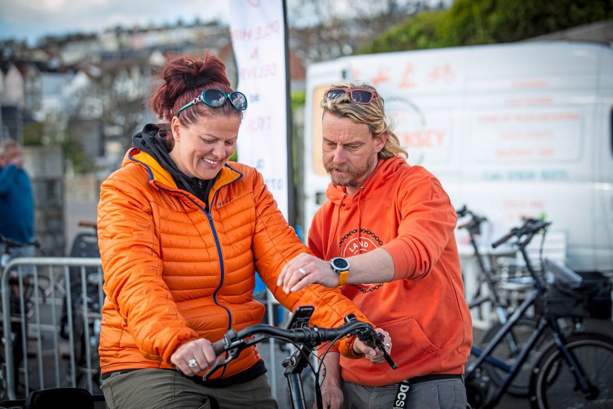 Silvi Kovacic trying out a bike from Go Guernsey, Phil Le Poidevin showing her controls at yesterday’s E-Bike Expo at North Beach, a joint initiative run by the Guernsey Bicycle Group, Adventure Cycles, Go Guernsey and the Health Improvement Commission. (Picture by Sophie Rabey, 30680772)