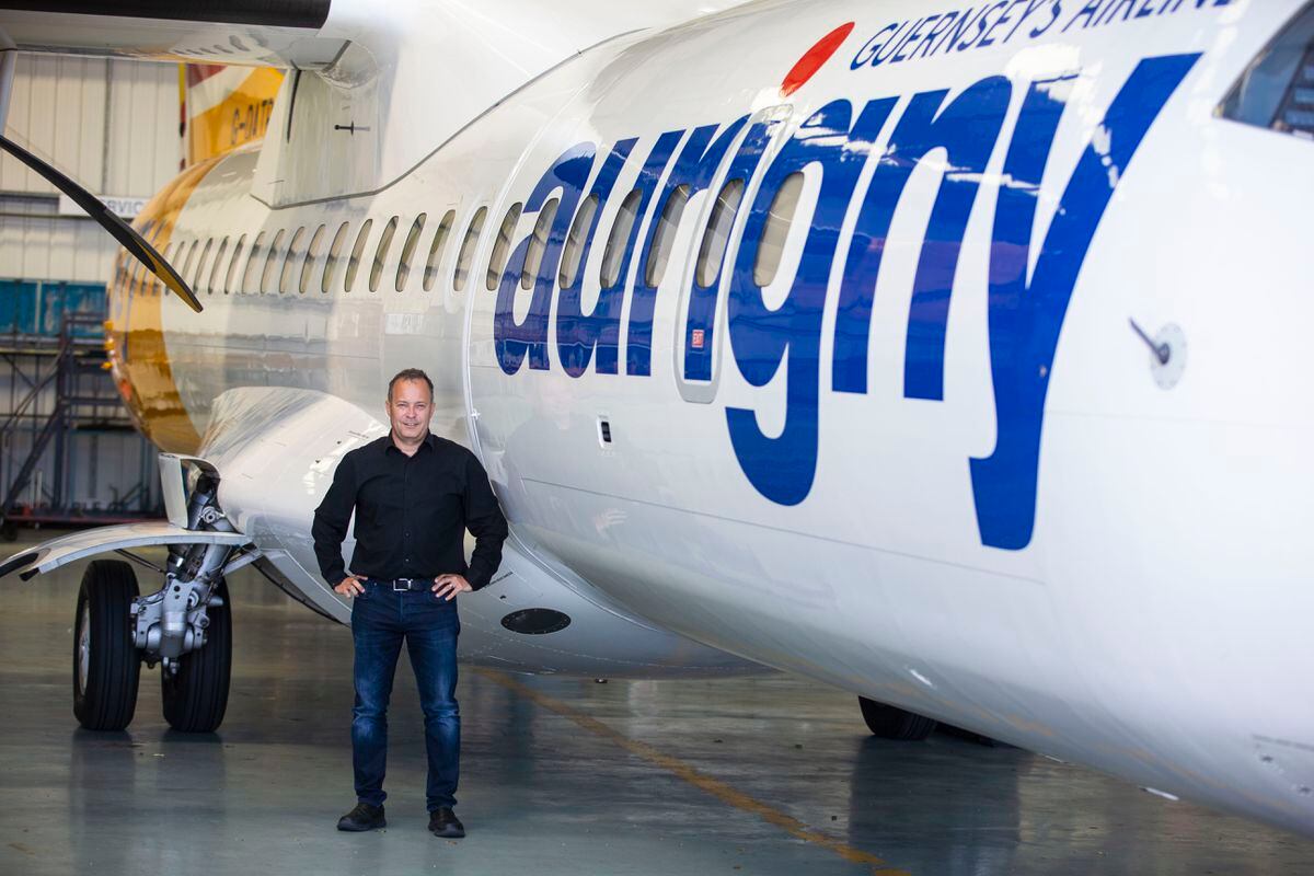 Aurigny CEO Nico Bezuidenhout alongside one of its three ATR aircraft. One way it saved money was flying full ATRs rather than the Embraer jet with half the seats empty. (Picture by Peter Frankland, 31061012)