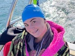 Delphine Riley set records as the youngest and fastest person to swim from Guernsey to Alderney while not wearing a wetsuit.